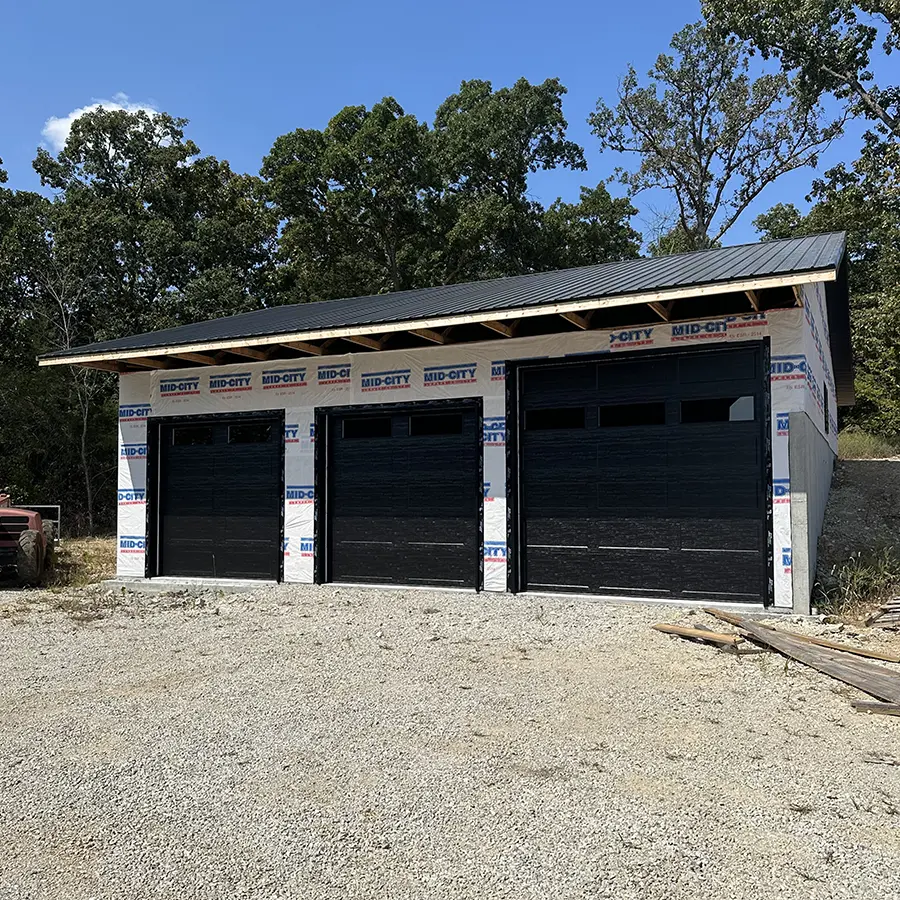 Stand alone garage with three newly installed doors