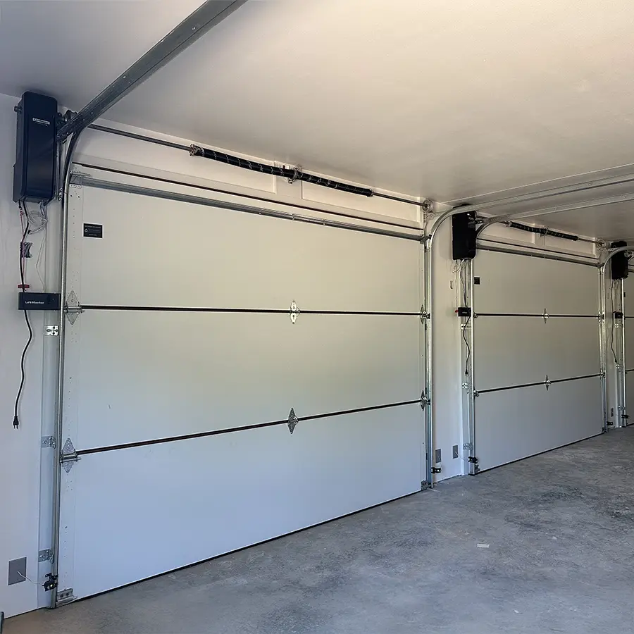 Three freshly repaired garage doors